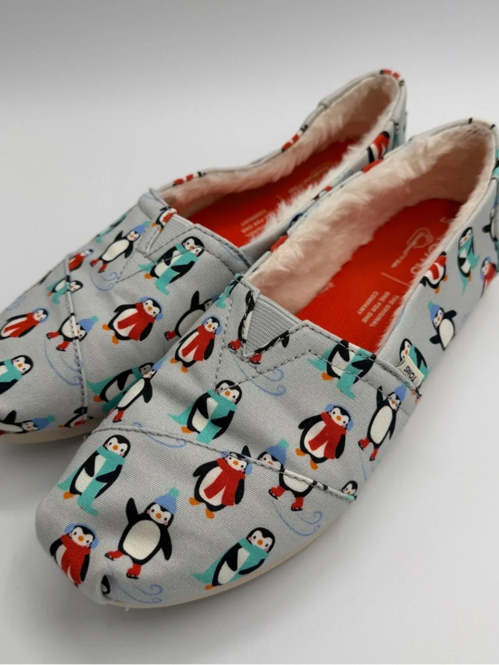 Toms Penguin-Print Slip-Ons in Light Gray with Teal and Red Accents - Picture 2 of 4